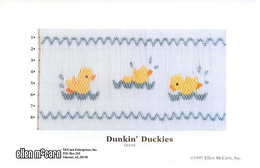 Smocking design of three yellow ducks in nests with a blue zigzag border, labeled 'Dunkin' Duckies'.