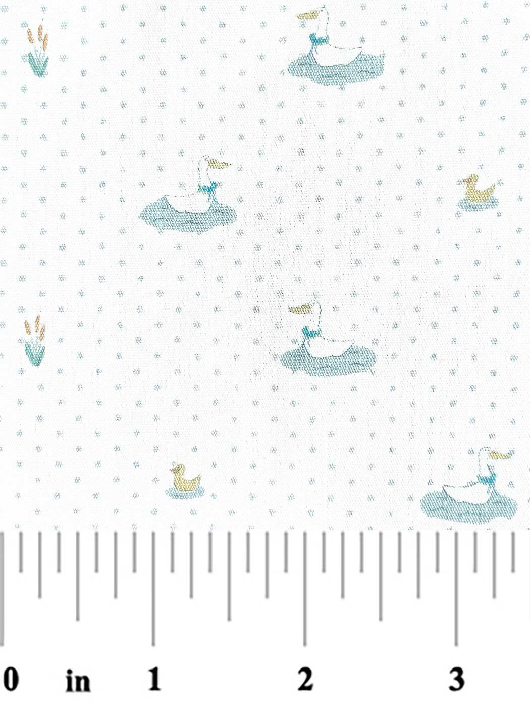 Fabric with small whale patterns on a white background, featuring a ruler at the bottom.