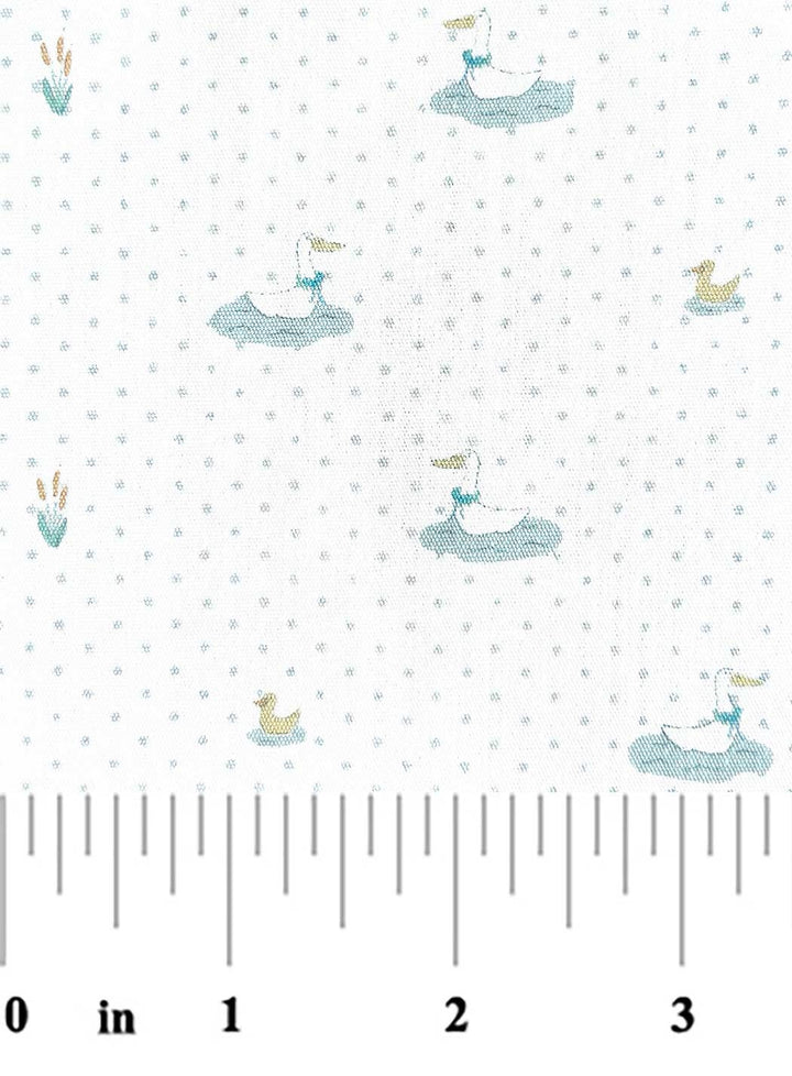 Fabric with small whale patterns on a white background, featuring a ruler at the bottom.