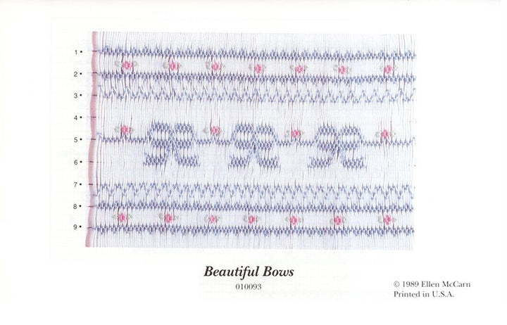 Smocking plate with blue bows and pink flowers in a geometric design on white pleated fabric. 9 rows of smocking on a yoke.  