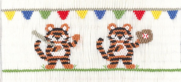 Smocking plate with two tigers playing baseball. 8 rows of smocking on a yoke.