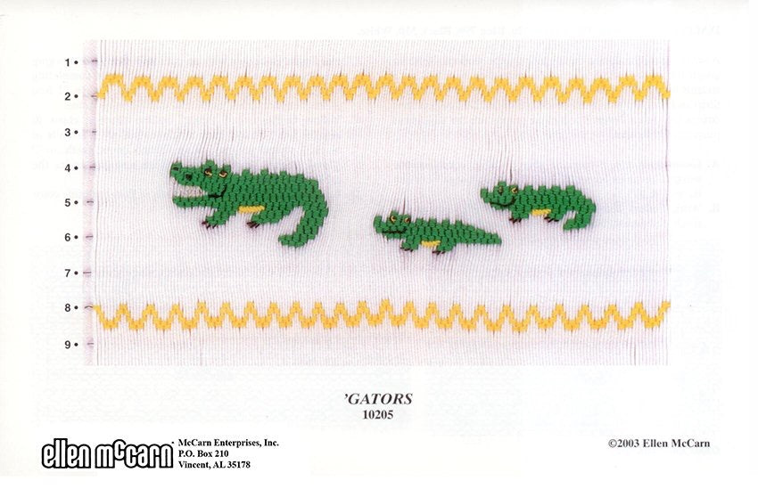 Smocking design of alligators on a white background with yellow wavy lines.