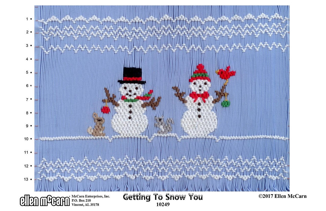 Smocking design of two snowmen with a blue background