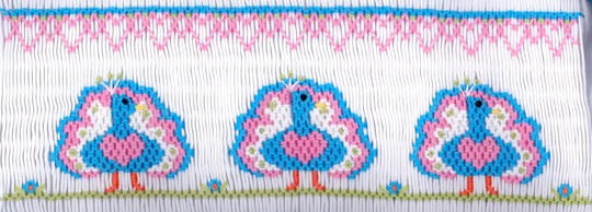 Smocking plate with three peacocks. 8 rows of smocking on a yoke.