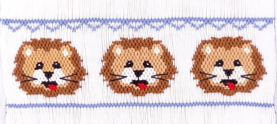 Smocking plate with three lion heads. 7 1/2 rows of smocking on a yoke.