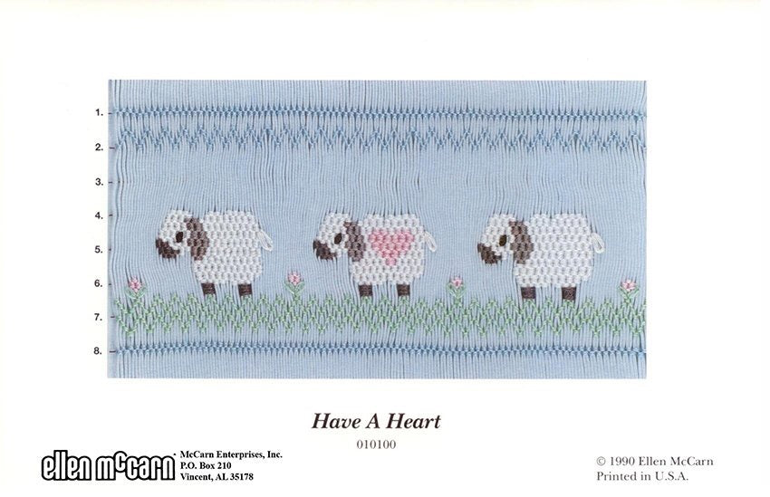 Smocking design of three sheep with a heart, labeled 'Have A Heart', on a blue background.