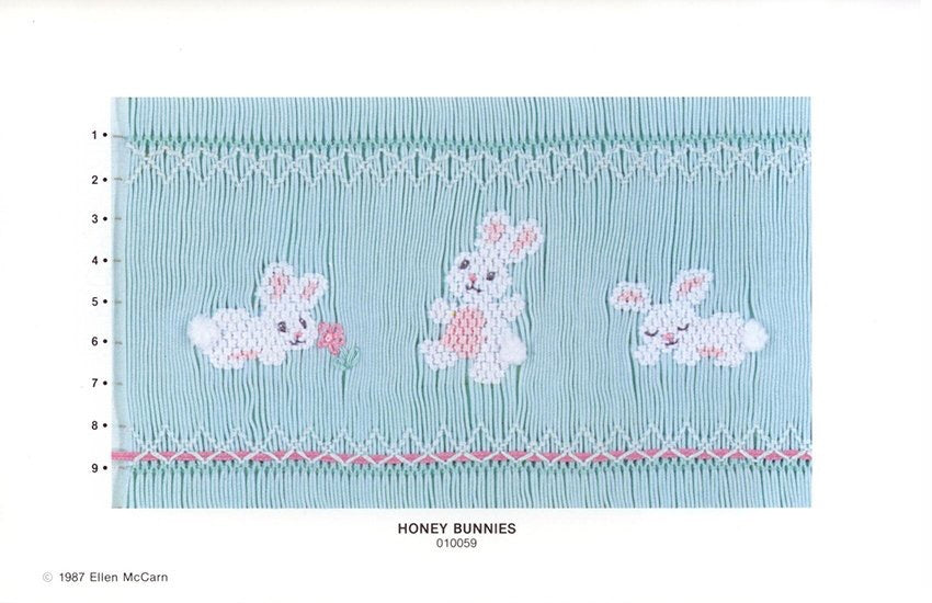 Smocking plate with three bunnies with a fuzzy tail. 9 rows of smocking