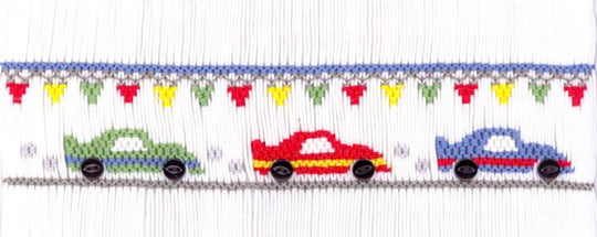Smocking plate with race cars and flags. 5 rows of smocking on a yoke.