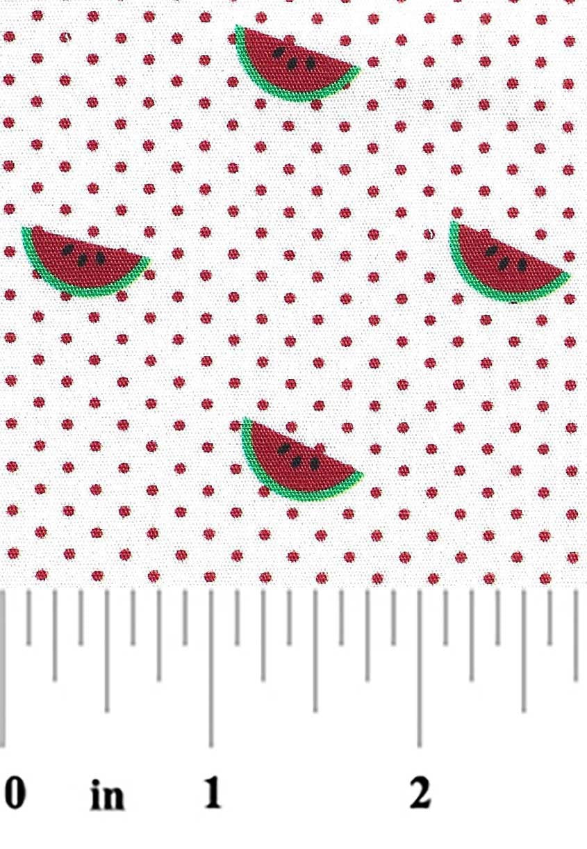 Fabric with watermelon slices and red polka dots, measured against a ruler.