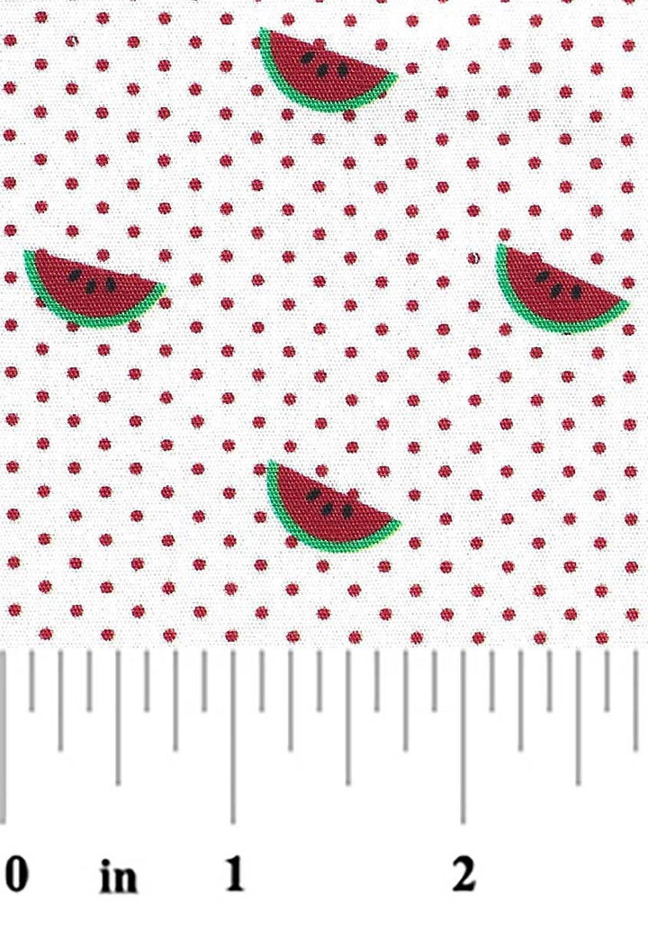 Fabric with watermelon slices and red polka dots, measured against a ruler.