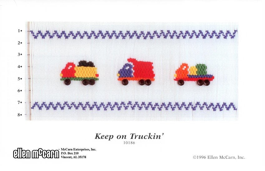 Smocking design of colorful trucks on a white background with 'Keep on Truckin'' text.
