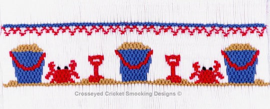 Beach-themed smocking plate with crabs, buckets, and a shovel on a white background.