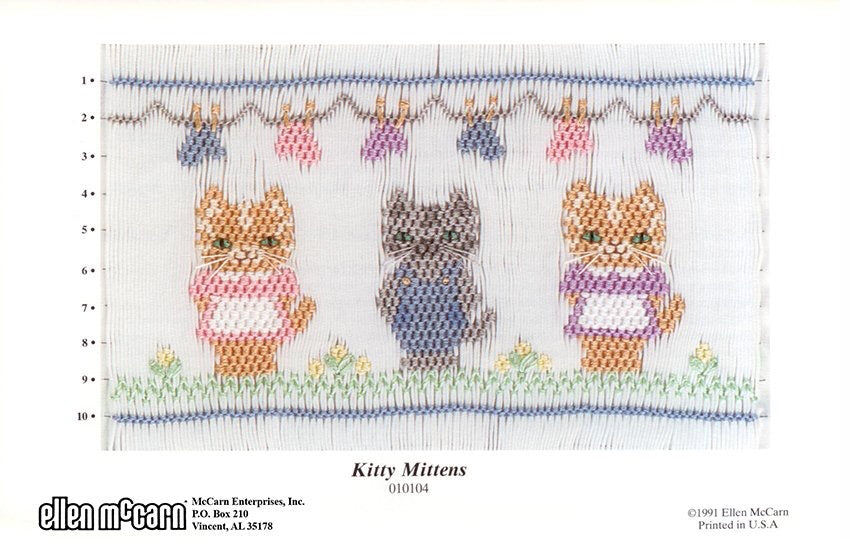 Smocking design of three cats with mittens hanging on a clothesline at the top.