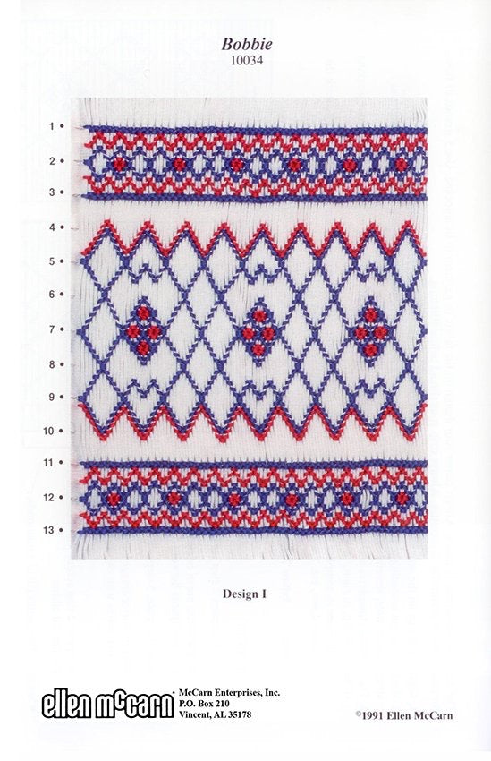 smocking plate with geometric design smocked in red and blue on white pleated fabric