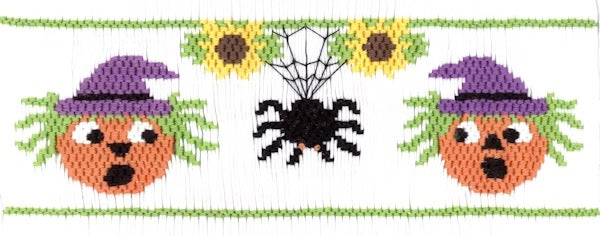 Smocking plate with a spider and scared faces. 7 1/2 rows of smocking on a yoke.