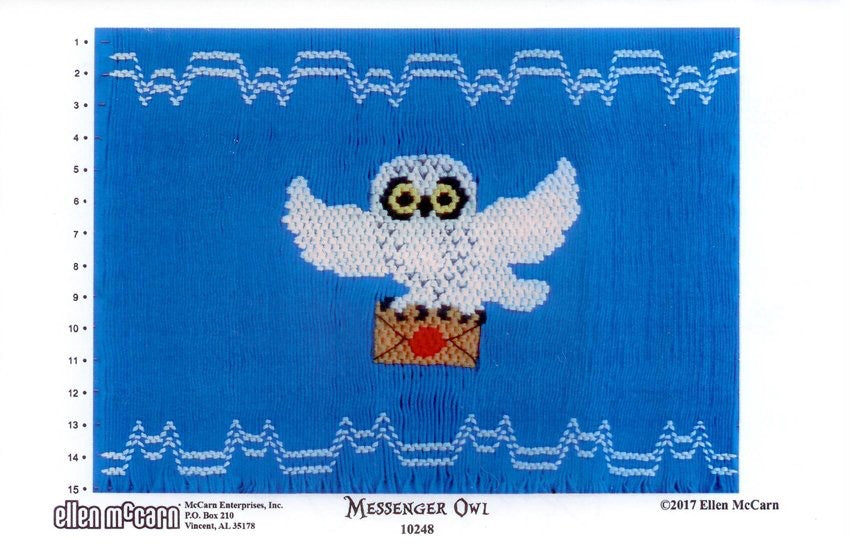 Smocking design of a white owl with an envelope on a blue background
