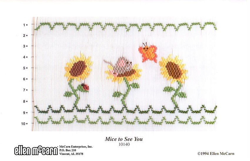 Smocking plate with three sunflowers and a mouse in one of the sunflowers with a butterfly. 10 rows of smocking 