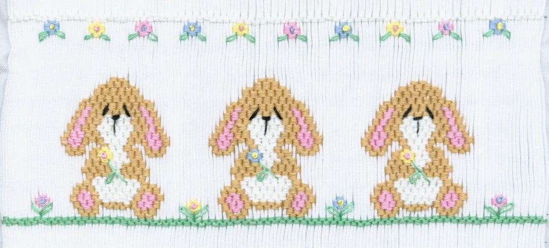 Smocking plate with three loppy eared bunnies. 8 1/4 rows of smocking on a yoke.
