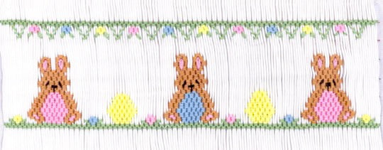 Smocking plate with rabbits and eggs. 6 1/2 rows of smocking on a yoke.