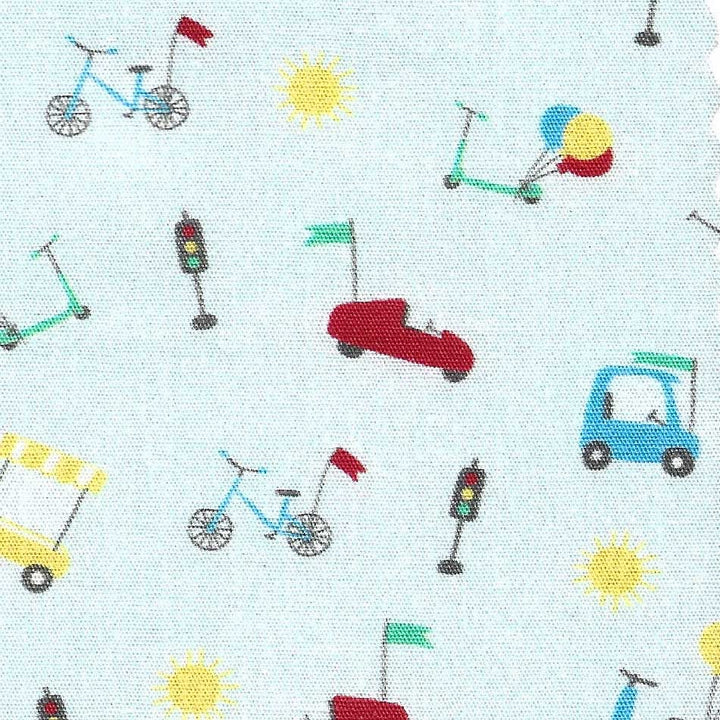 Pattern of colorful toy vehicles and traffic lights on a light blue background