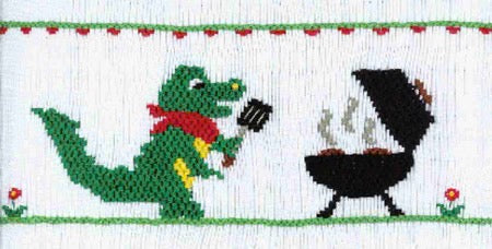 Smocking plate with an alligator holding a spatula grilling some burgers for a tailgate. 9 1/2 rows of smocking on a yoke.