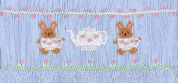Smocking plate with two bunnies holding teacups and a teapot. 9 3/4 rows of smocking on a yoke.