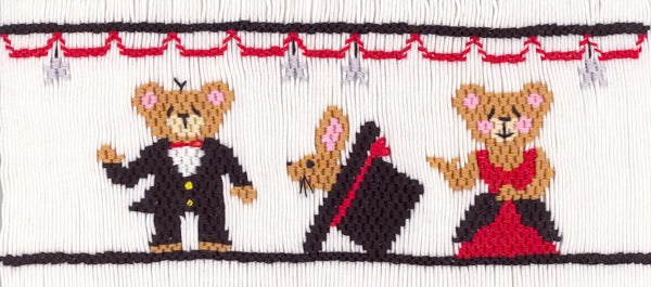 Smocking plate with two magician bears and a rabbit in a hat. 8 rows of smocking on a yoke.