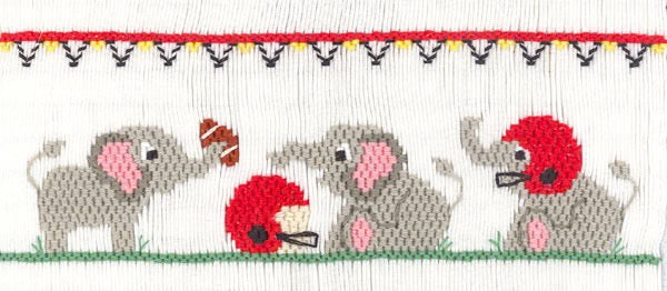 Smocking plate with three elephants wearing football helmets and a football. 7 1/2 rows of smocking on a yoke.