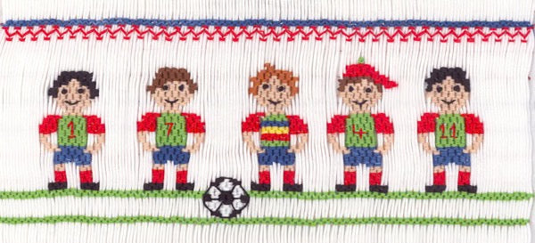 Smocking plate with soccer players in a row with a soccer ball. 8 1/2 rows of smocking on a yoke.