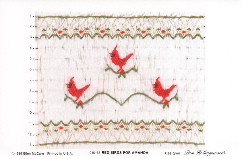 Smocking plate with three red birds (cardinals), 13 rows of smocking.