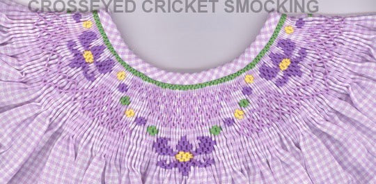 Smocking plate with three fleur de lis. 6 rows of smocking on a bishop.