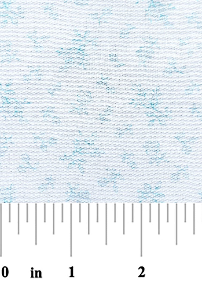 soft blue flora print on a white background with a ruler at bottom for scale