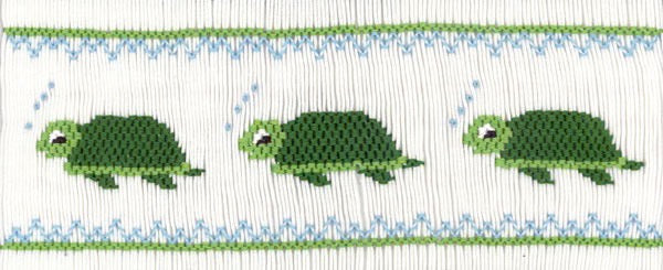Smocking plate with three swimming turtles. 8 rows of smocking on a yoke.