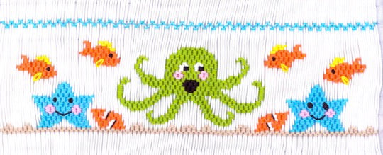 Smocking plate with an octopus, fish and starfish. 7 rows of smocking on a yoke.
