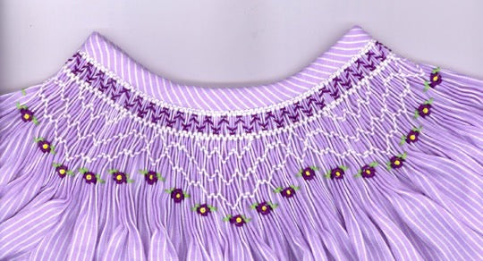Smocking plate with geometric pattern with violets. 6 rows of smocking on a bishop.