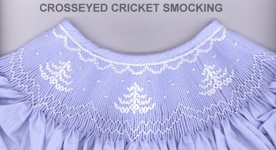 Smocking plate with a simple tree and some snow falling. 7 rows of smocking on a bishop.