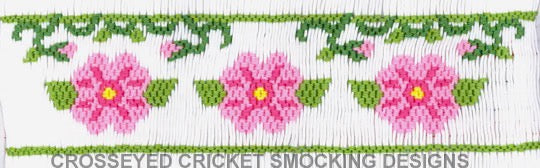 Smocking plate with wild roses and vines. 6 rows of smocking on a yoke.