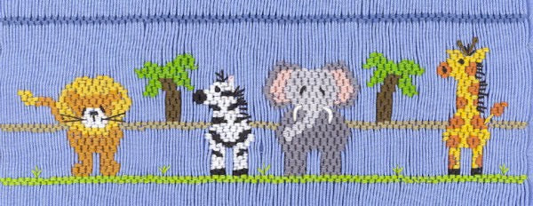 Smocking plate with a tiger, zebra, elephant, and giraffe. 7 rows of smocking on a yoke.