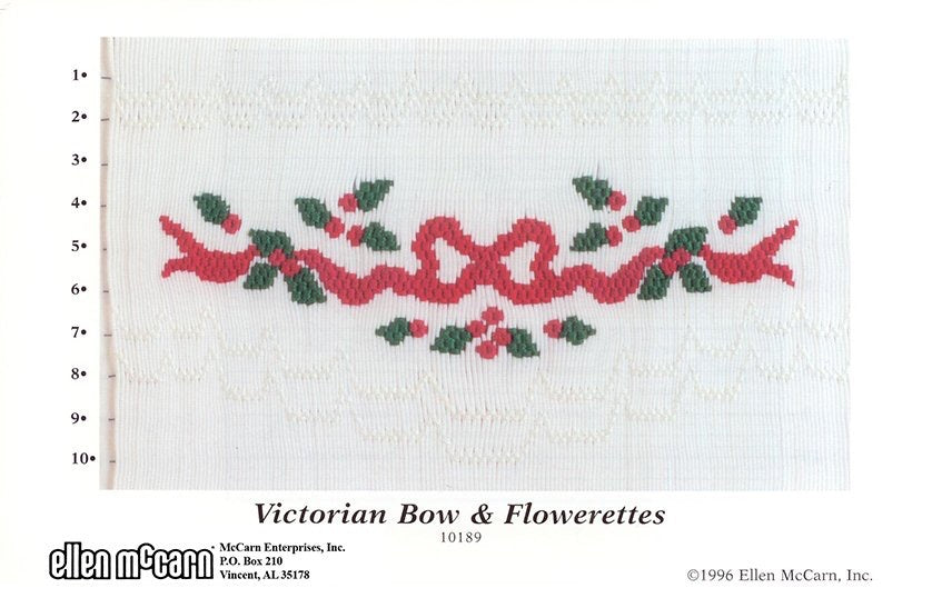 Smocking plate with a Victorian bow and holly berries, 10 rows of smocking.