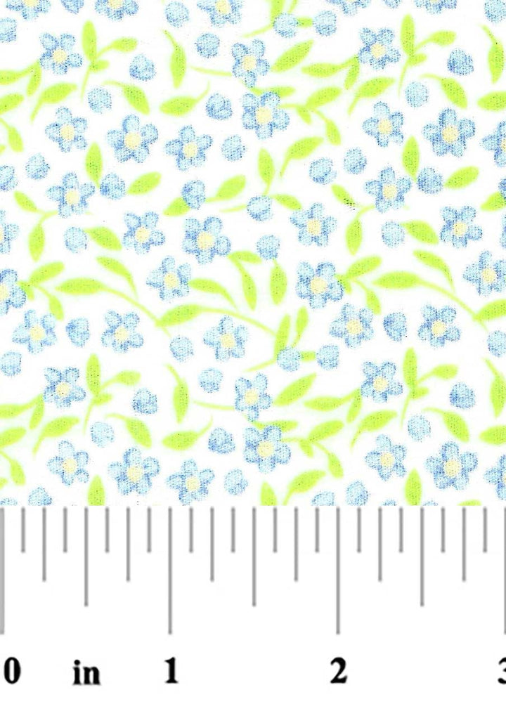 Floral pattern with blue flowers and green leaves on a white background, measured by a ruler.