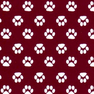 Pattern of white paw prints on a red background