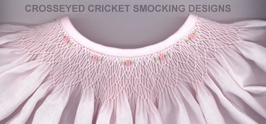 Close-up of a pink garment with smocking details on a gray background