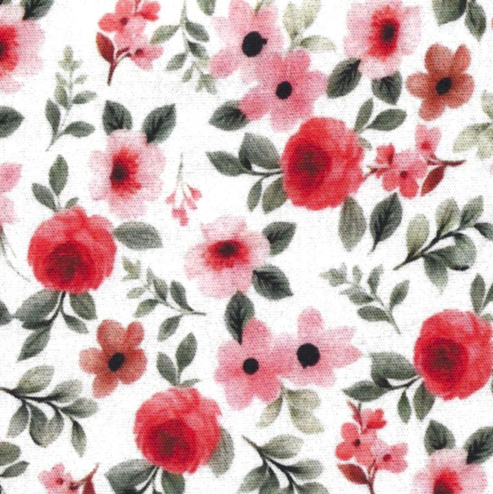 red, pink, and green floral print on a solid white background. 