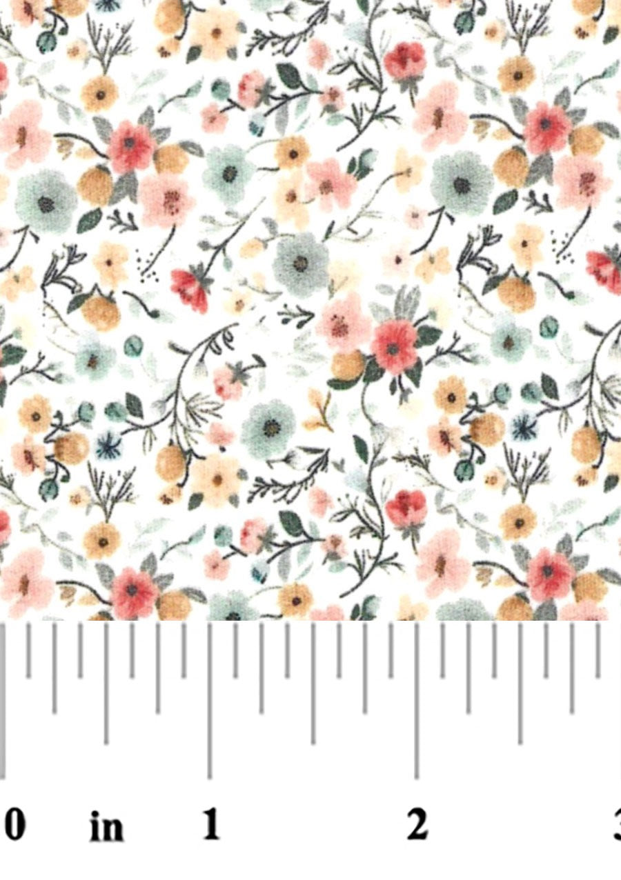 Fabric swatch with red, blue, gold, and pink flowers