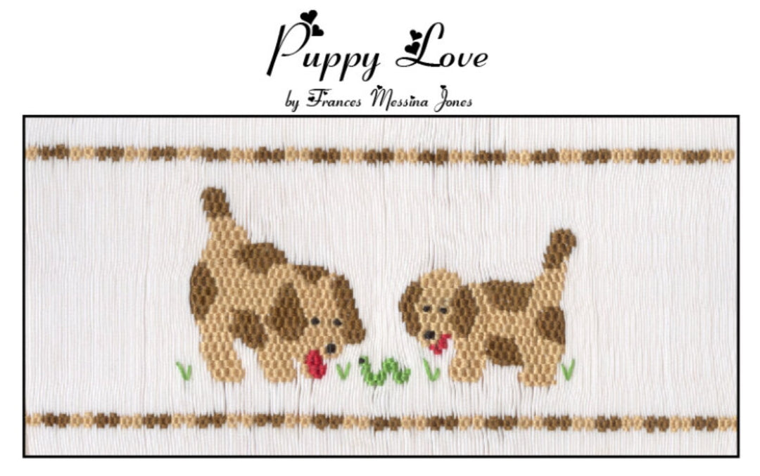 Smocking Plate  titled 'Puppy Love' by Frances Messina Jones, featuring two brown and tan puppies with red tongues on a white fabric background, framed by decorative brown and beige horizontal bands with small green grass accents.