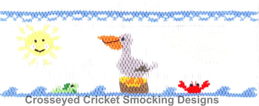 Smocking plate with a smiling sun with a pelican and crab and fish. 7 1/2 rows and 164 pleats of smocking on a yoke.