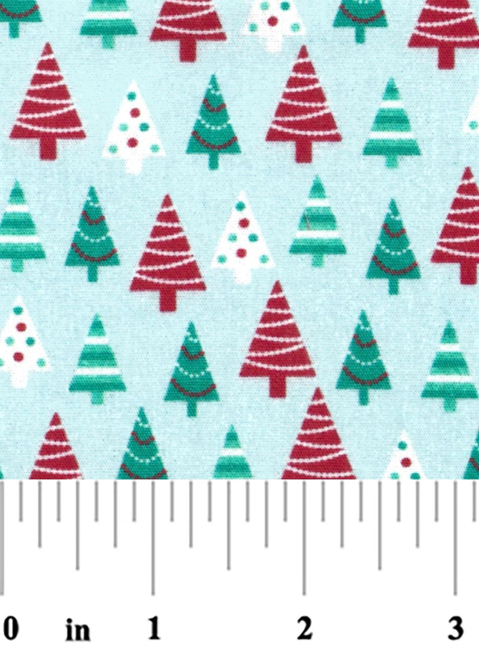 fabric swatch of red and green Christmas Trees on a light blue background with a ruler at the bottom for scale.