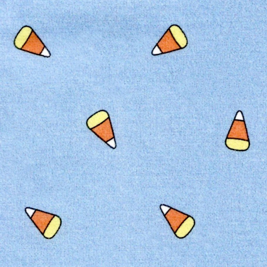 fabric swatch of candy corn on a blue background