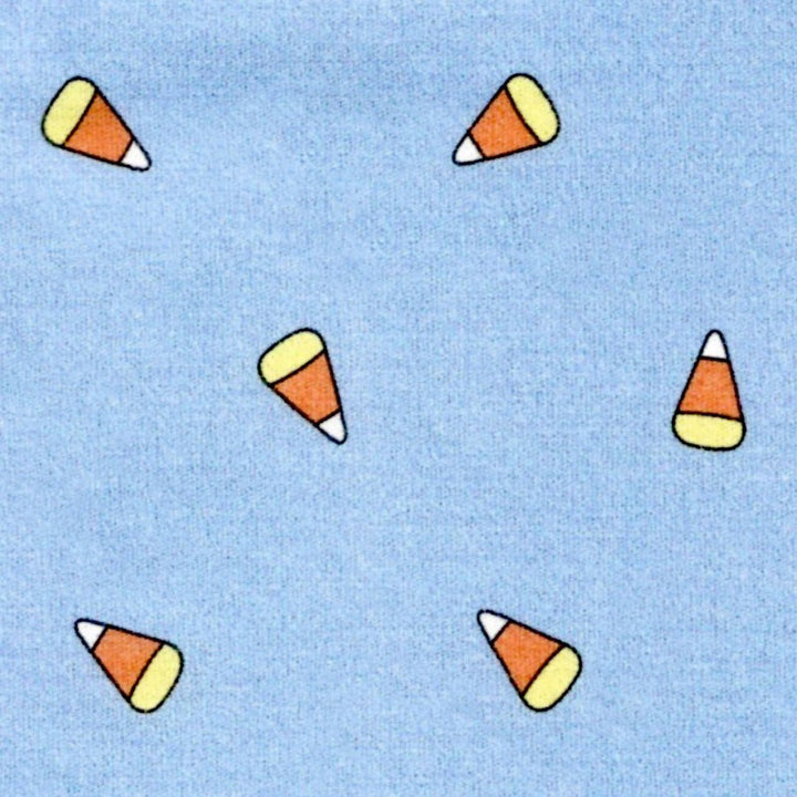 fabric swatch of candy corn on a blue background