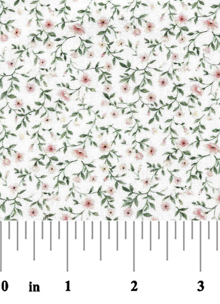 fabric swatch of a pink and green floral on a white background with a ruler at the bottom for scale